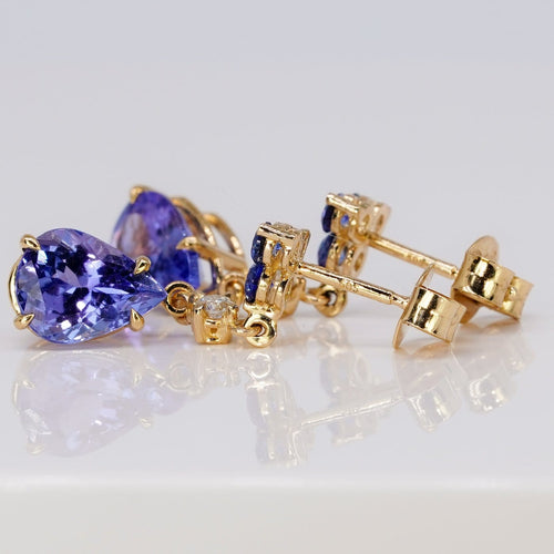 Boucles d'oreilles Boucles d’oreilles pendantes articulées en or jaune 14 carats, tanzanites, saphirs et diamants 58 Facettes E0067