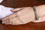 Bracelet Art déco en or blanc, émeraudes et diamants, env. 4,30 ct 58 Facettes 13446