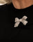 Broche Broche nœud en platine et diamants 58 Facettes LOT 6847