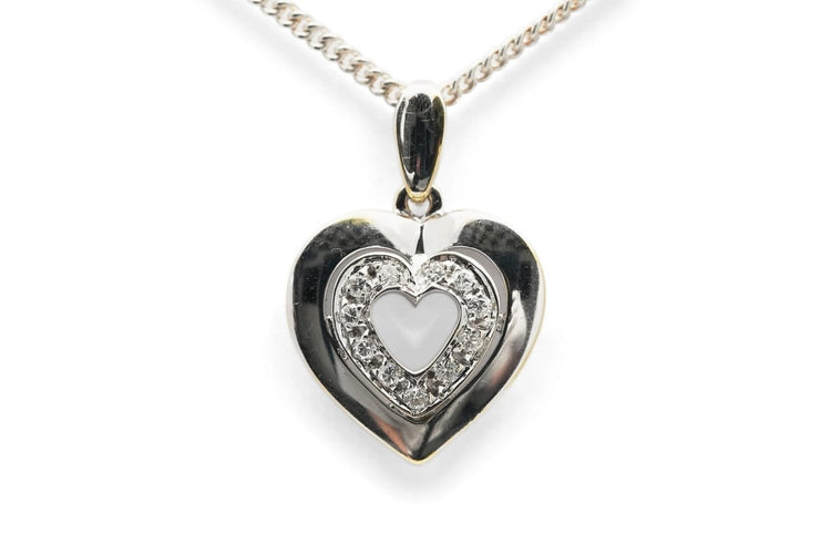 Pendentif Pendentif cœur en or blanc 18 carats et diamants taille brillant (env. 0,12 ct) 58 Facettes B978