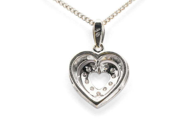 Pendentif Pendentif cœur en or blanc 18 carats et diamants taille brillant (env. 0,12 ct) 58 Facettes B978