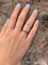 Bague 51.5 Alliance américaine en or gris 18 carats et rubis 58 Facettes 199