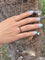 Bague 51.5 Alliance américaine en or gris 18 carats et rubis 58 Facettes 199