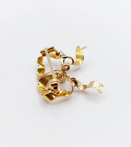 Broche Broche nœud en or 18k avec diamant taille ancienne, vers 1920 58 Facettes A08093