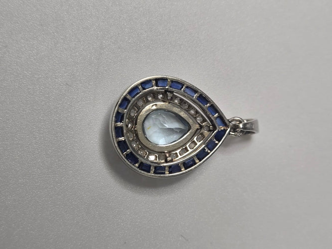 Pendentif Pendentif en or blanc avec aigue-marine, saphirs et diamants 58 Facettes Bague_009