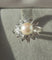 Bague 49.5 Bague fleur en or blanc 18 carats, perle de culture et diamants 58 Facettes Bague