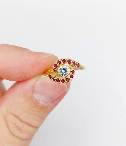 Bague 46 Bague tourbillon en or 18k, diamant et rubis, vers 1920 58 Facettes A08114