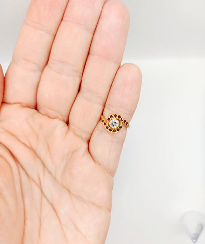 Bague 46 Bague tourbillon en or 18k, diamant et rubis, vers 1920 58 Facettes A08114