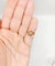 Bague 46 Bague tourbillon en or 18k, diamant et rubis, vers 1920 58 Facettes A08114