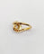 Bague 46 Bague tourbillon en or 18k, diamant et rubis, vers 1920 58 Facettes A08114