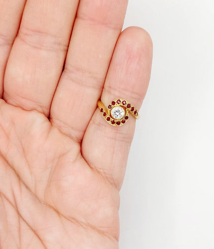 Bague 46 Bague tourbillon en or 18k, diamant et rubis, vers 1920 58 Facettes A08114