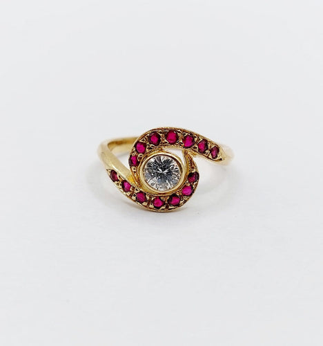 Bague 46 Bague tourbillon en or 18k, diamant et rubis, vers 1920 58 Facettes A08114