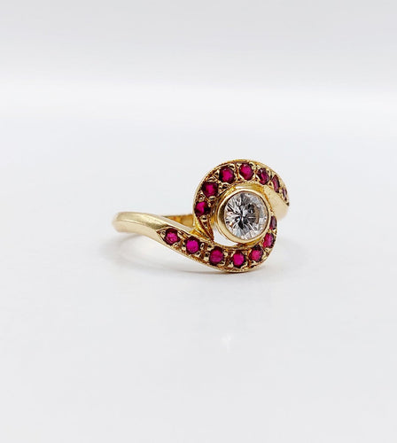 Bague 46 Bague tourbillon en or 18k, diamant et rubis, vers 1920 58 Facettes A08114
