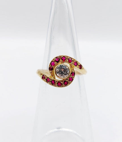 Bague 46 Bague tourbillon en or 18k, diamant et rubis, vers 1920 58 Facettes A08114