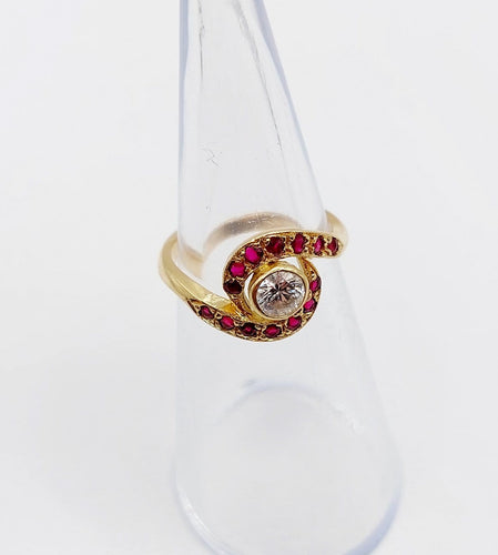 Bague 46 Bague tourbillon en or 18k, diamant et rubis, vers 1920 58 Facettes A08114