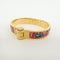 Bracelet Hermès - Bracelet Charnière Uni en métal et émail doré 58 Facettes qspt2ekaw9