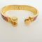 Bracelet Hermès - Bracelet Charnière Uni en métal et émail doré 58 Facettes qspt2ekaw9