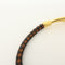Bracelet Hermès - Bracelet Jumbo Hook en cuir tressé et métal 58 Facettes e24u36e4eb