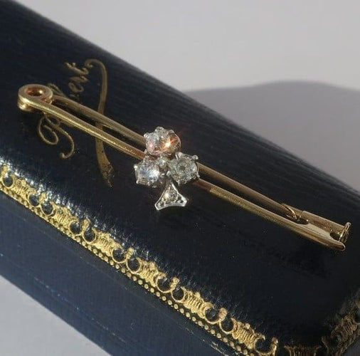 Broche Broche barrette trèfle, or jaune 18 carats, platine et diamants 0,49 ct 58 Facettes Broche