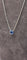 Collier Collier en or blanc 18 carats 750/1000 avec saphir cabochon bleu de Ceylan 58 Facettes 1CA0000002