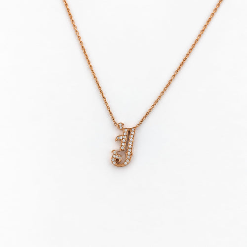 https://18carats.fr/wp-content/uploads/2026/07/38013-39519-Collier-en-or-jaune-pendentif-J-pave-de-diamants.jpeg