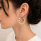 Boucles d'oreilles Boucles d'oreilles créoles en or jaune 18 carats et perles 58 Facettes 27556