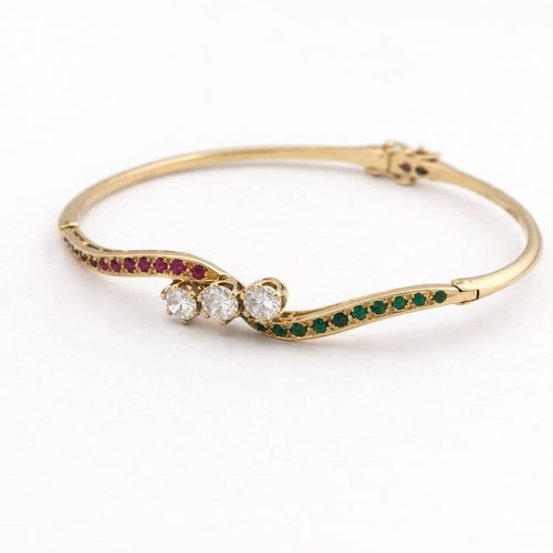 Bracelet Bracelet jonc en or jaune avec diamants, rubis et émeraudes 58 Facettes 31215