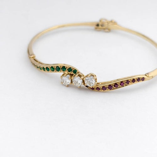 Bracelet Bracelet jonc en or jaune avec diamants, rubis et émeraudes 58 Facettes 31215