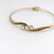 Bracelet Bracelet jonc en or jaune avec diamants, rubis et émeraudes 58 Facettes 31215