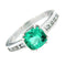 Bague Guidetti - Bague en or blanc avec émeraude centrale et diamants taille princesse 58 Facettes G324