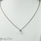 Collier Collier en or blanc 18 carats avec pendentif perle et diamants 58 Facettes 2251