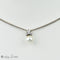 Collier Collier en or blanc 18 carats avec pendentif perle et diamants 58 Facettes 2251