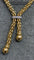 Collier Collier maille Popcorn à pompons en or 18 carats 58 Facettes