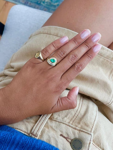 Bague 54 Bague Tourbillon or jaune, émeraude et diamants 58 Facettes