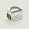 Bague 51.5 Bague moderniste en or gris et péridot 58 Facettes ALB2061