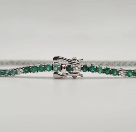 Bracelet Rivière or blanc sertie de diamants et émeraudes 58 Facettes
