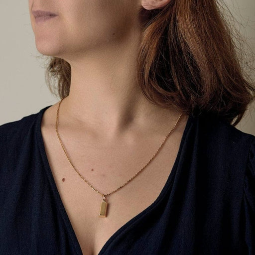 Pendentif Cartier - Pendentif Charm's lingot ¼ oz en or jaune 18k 58 Facettes DADB-13