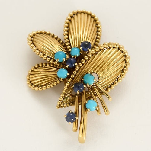 Broche Broche Mauboussin en or jaune, turquoises et saphirs 58 Facettes 58FC115