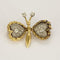 Broche Broche papillon en Or jaune, or gris et diamants 58 Facettes CAN1572