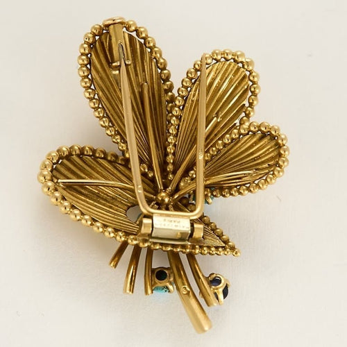 Broche Broche Mauboussin en or jaune, turquoises et saphirs 58 Facettes 58FC115