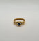 Bague 56 Bague or jaune sertie de diamants et d’un saphir 58 Facettes