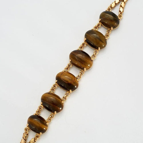 Bracelet Bracelet articulé en or jaune 18k et œil de tigre 58 Facettes