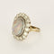 Bague 53.5 Importante bague marguerite en or blanc, opale et diamants 58 Facettes FOU1633