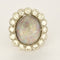 Bague 53.5 Importante bague marguerite en or blanc, opale et diamants 58 Facettes FOU1633