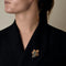 Broche Broche Mauboussin en or jaune, turquoises et saphirs 58 Facettes 58FC115