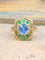 Bague 53 Bague entourage en or jaune 18 carats au saphir, tanzanites et diamants 58 Facettes Hh