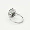 Bague 53 Bague marguerite or blanc, émeraude et diamants 58 Facettes EPI10662