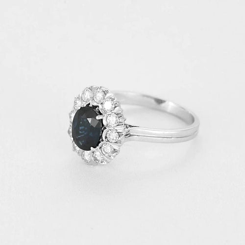 Bague 55 Bague marguerite - Bague en or gris 18k, saphir ovale et diamants 58 Facettes BA514
