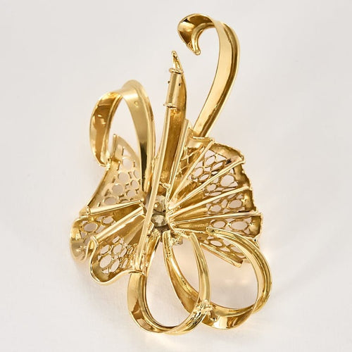 Broche Splendide Broche noeud stylisée en or jaune et diamants 58 Facettes ROD4591