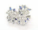 Broche Broche en or blanc 18 kt avec diamants et saphirs 58 Facettes 8226